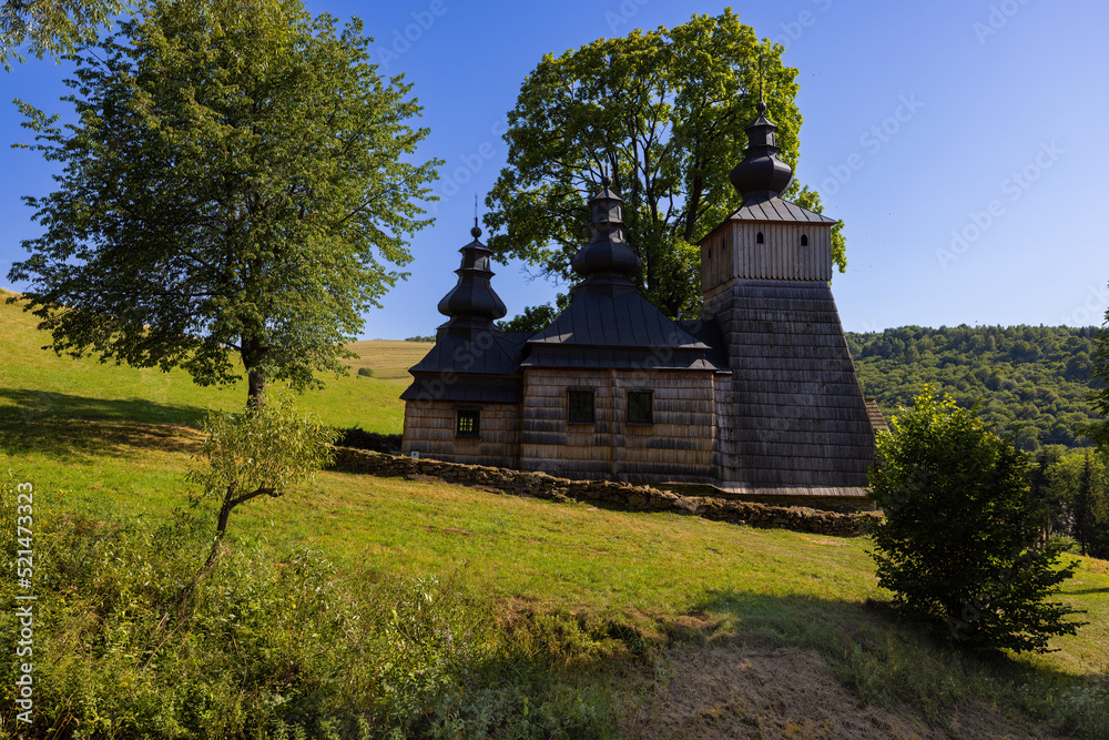 Old orthodox church under the tree on the hill at clear day. Old orthodox church under the tree on the hill at clear day.