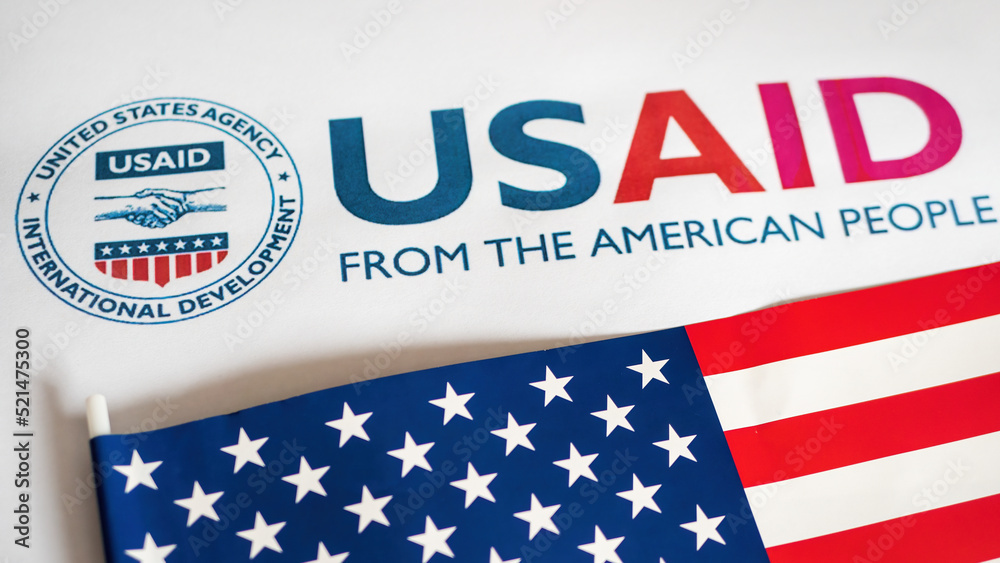 Usaid Logo Letterhead And Us Flag In Foreground Stock Photo Adobe Stock