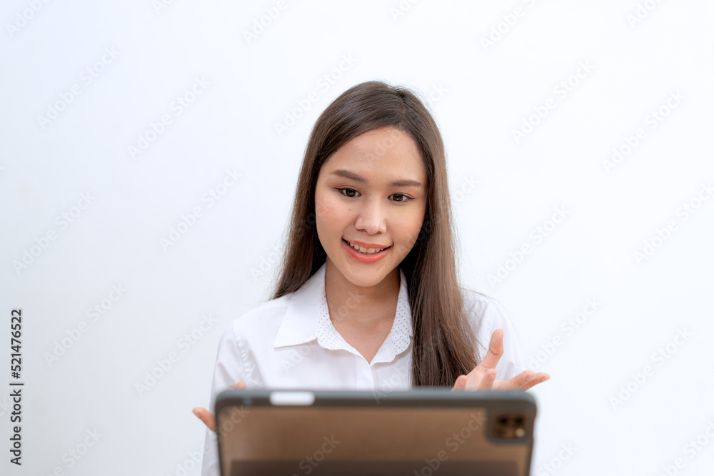 Asian female work from home meeting with team from computer tablet on the bed in her room connecting online by internet Asian female work from home meeting with team from computer tablet on the bed in her room connecting online by internet
