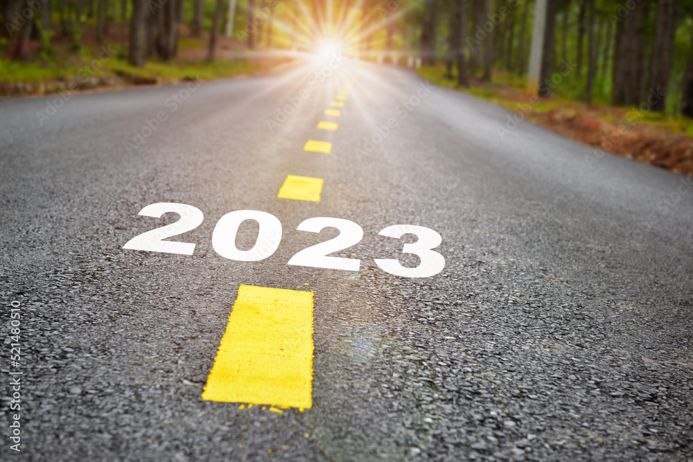 Obraz premium Road to 2022 with sunbeam. Business beginning challenge concept and growth mindset idea
