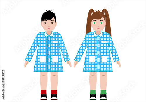 La vuelta al cole. Dos alumnos, niño y niña,  de educación infantil vestidos con la bata escolar azul o babi photo