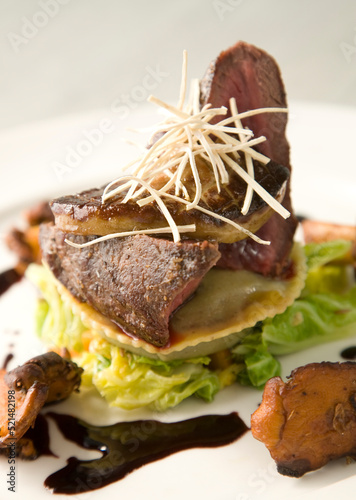 Springbok meat on bed of vegetables and shitake mushrooms, a true South African fine dining experience.