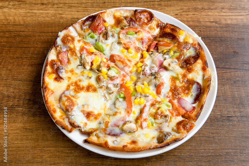 Delicious mixed pizza with rich content. Menu concept of choice and diversity Delicious mixed pizza with rich content. Menu concept of choice and diversity