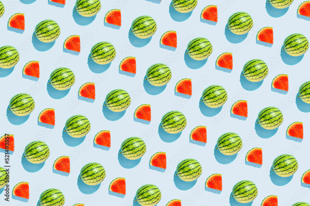 Watermelons, summer fruit, creative pattern on pastel blue background. Summer refreshment concept. Watermelons, summer fruit, creative pattern on pastel blue background. Summer refreshment concept.