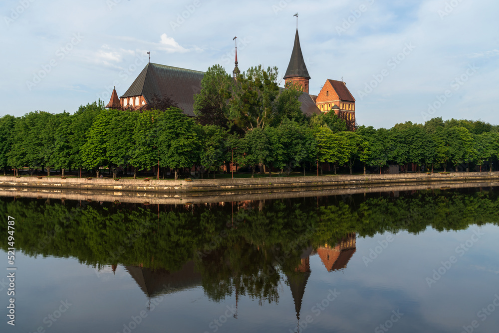 View of the Koningberg Cathedral on Immanuel Kant Island and the Pregolya River on a sunny summer day, Kaliningrad, Russia View of the Koningberg Cathedral on Immanuel Kant Island and the Pregolya River on a sunny summer day, Kaliningrad, Russia