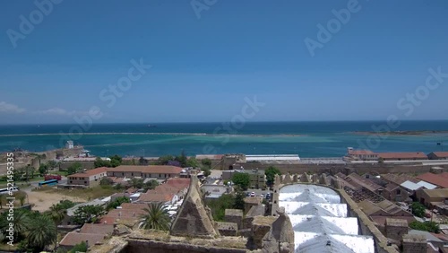 Editorial-Aerial footage of Lala Mustapha Pasha Mosque (formerly a church) in Famagusta city in North Cyprus, view over the roof of the mosque to the sea photo