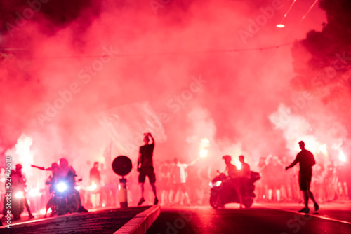 Red Star Football fans with torches and flags marching on streets and celebrating league title win in Belgrade, Serbia 22.05.2022