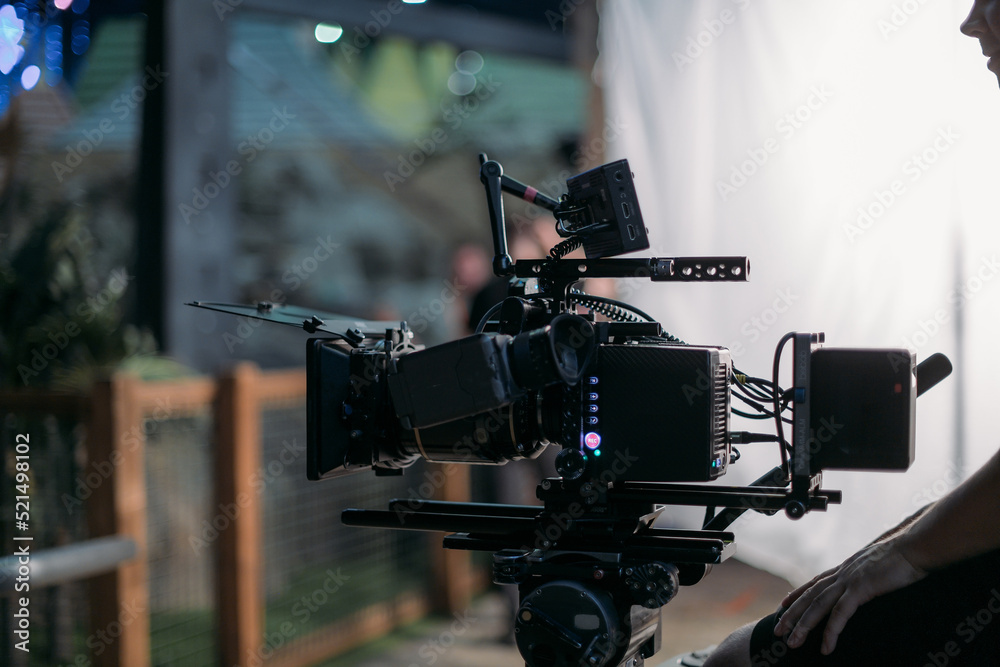 A professional film and video camera on the set. Filming day, equipment and crew. Technique of modern video filming. A professional film and video camera on the set. Filming day, equipment and crew. Technique of modern video filming.
