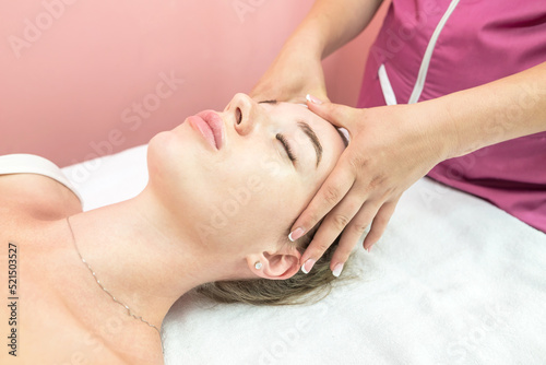 Beautiful girl doing facial massage