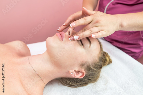 Beautiful girl doing facial massage