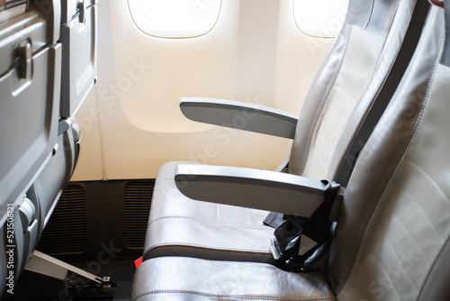 aircraft cabin interior  empty passenger seats inside close up
