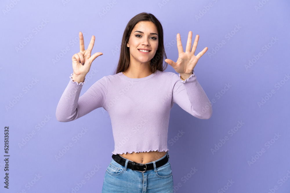 Young caucasian woman over isolated background counting eight with fingers Young caucasian woman over isolated background counting eight with fingers
