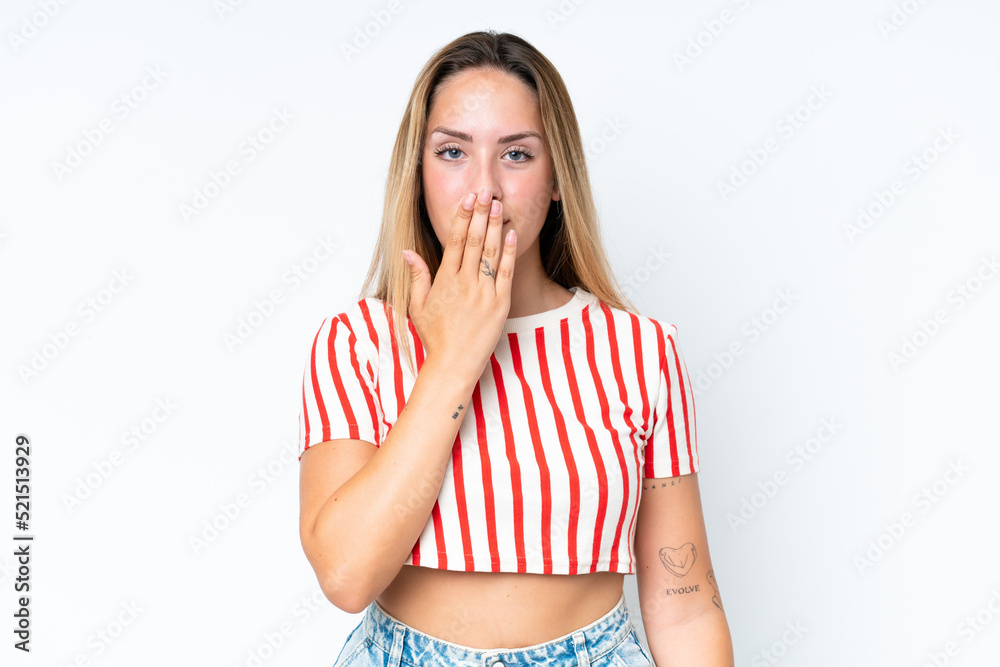 Young caucasian woman isolated on white background covering mouth with hand Young caucasian woman isolated on white background covering mouth with hand