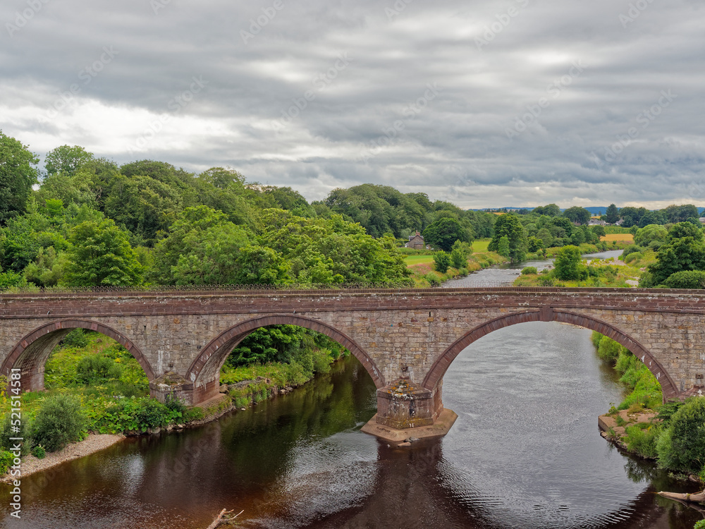 The Lower North Water Bridge on the Road to St Cyrus in Aberdeenshire on a Summers evening with low clouds above.