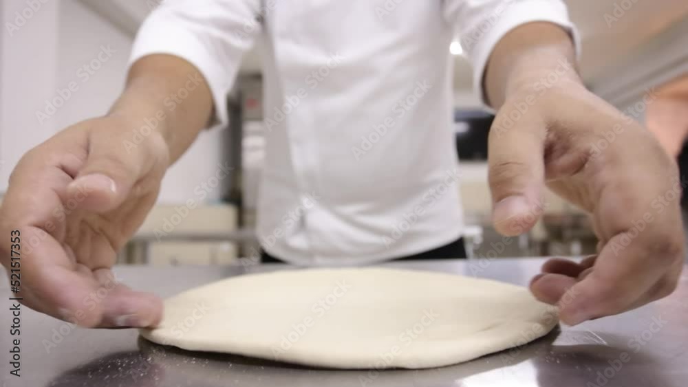 Preparation of pizza dough. preparing pizza in the restaurant kitchen Preparation of pizza dough. preparing pizza in the restaurant kitchen