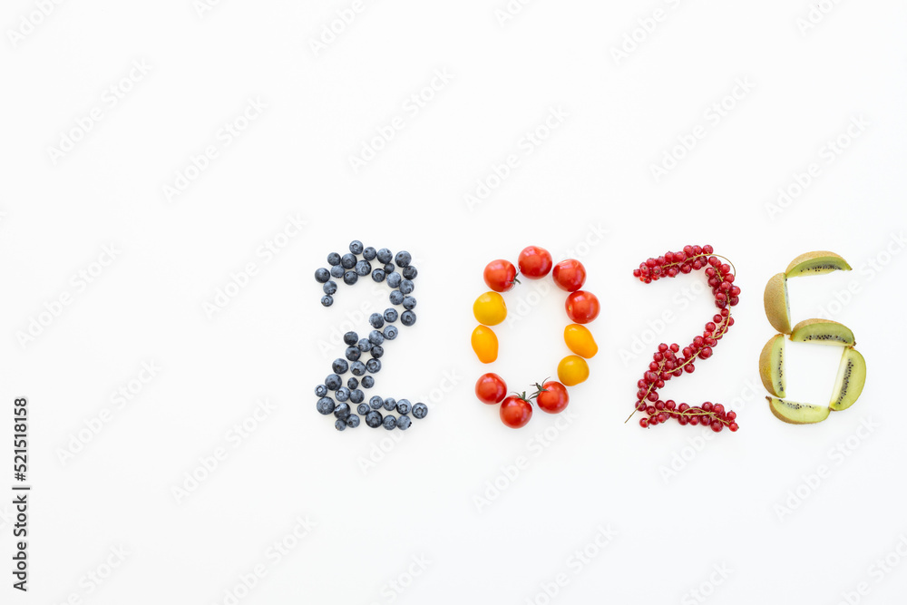 New year 2026 made of fruits on the white background. Healthy food