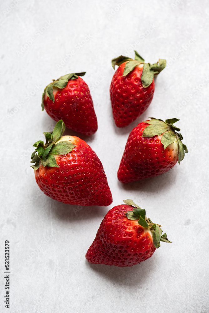 Fresh strawberries on a gray background. Top view. Fresh strawberries on a gray background. Top view.