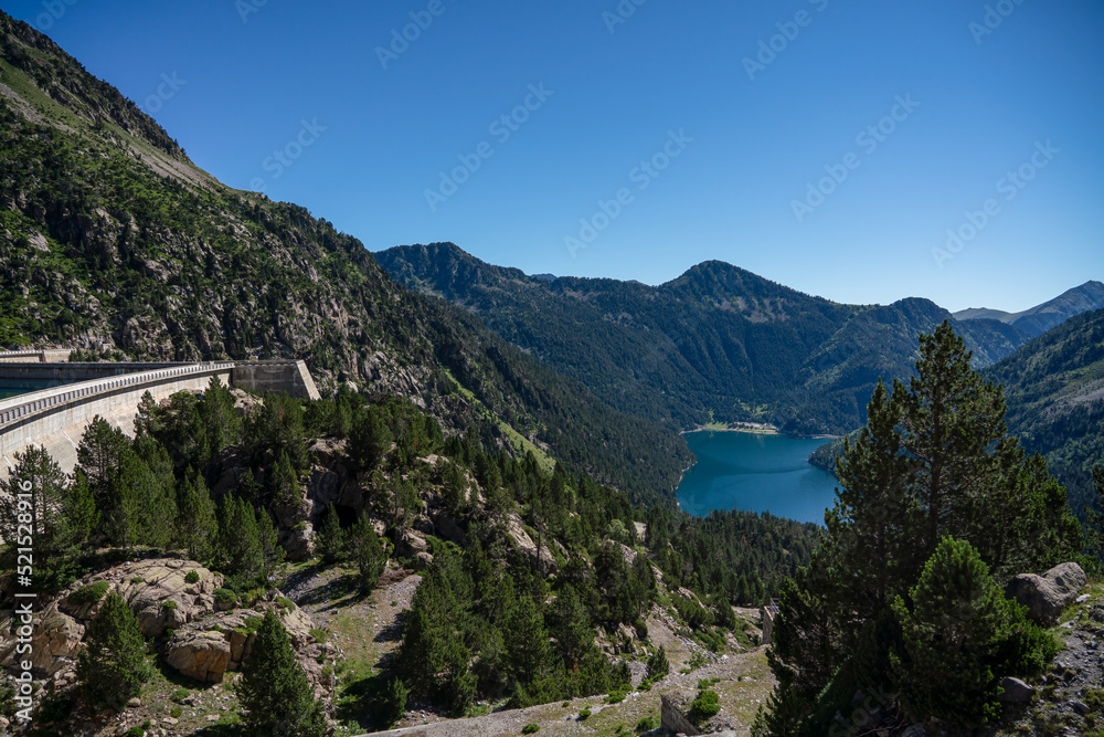 view over Lac d'Oredon from the Barrage dam Lac de Cap-de-Long, mountain setting , clear blue summer sky