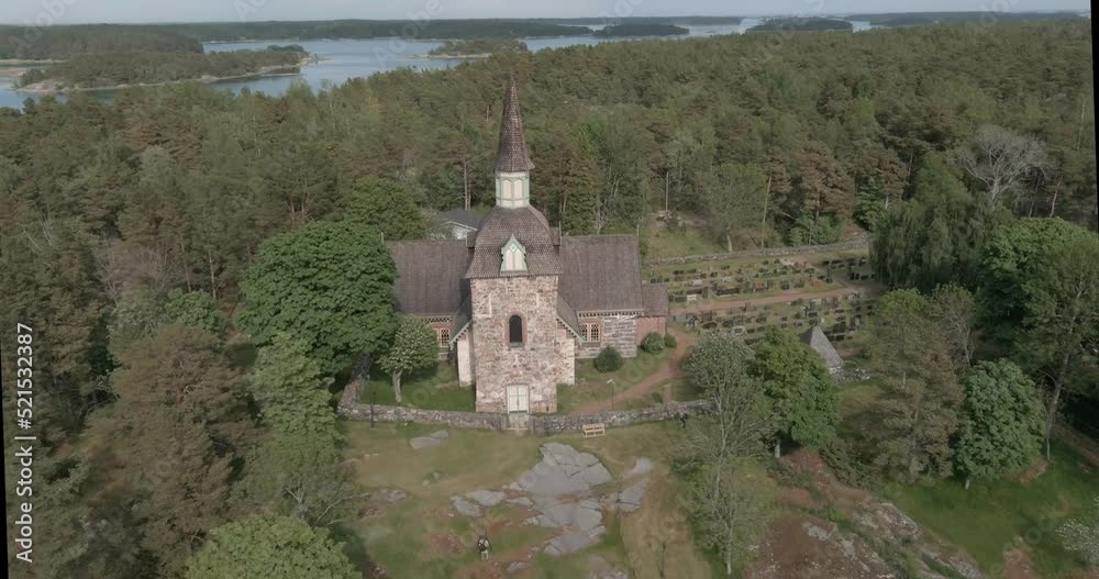 Aerial view of old Saint Maria Magdalena stone church in the summer at Föglö, Ahvenanmaa, Finland. Aerial view of old Saint Maria Magdalena stone church in the summer at Föglö, Ahvenanmaa, Finland.