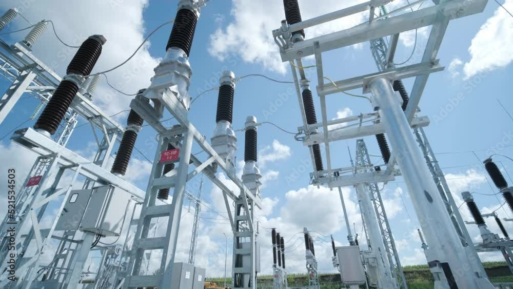 Many high voltage electrical insulators in power substation against ...