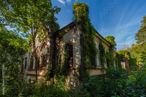 Old ruined overgrown abandoned historical Khvostov's mansion in Gothic style