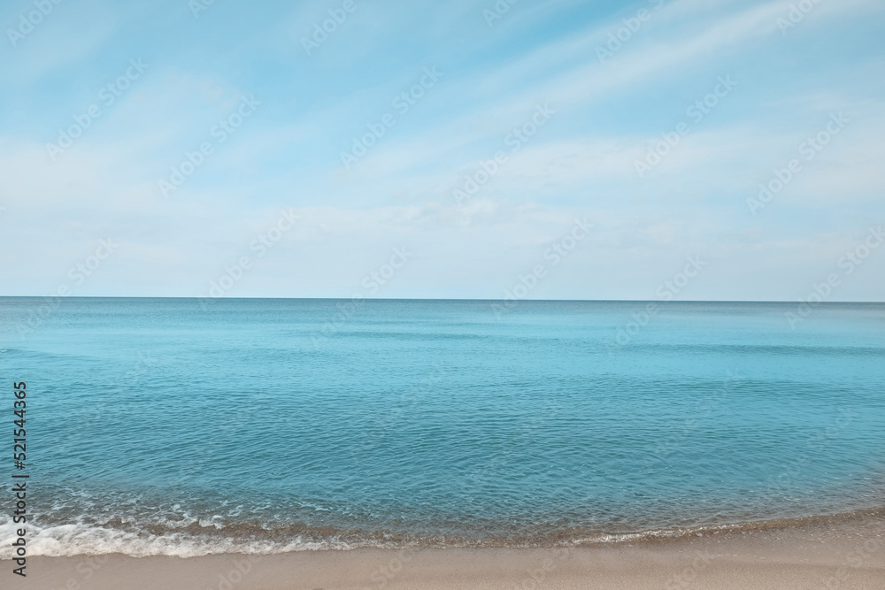 Beautiful view of sea shore under blue sky on sunny day Beautiful view of sea shore under blue sky on sunny day