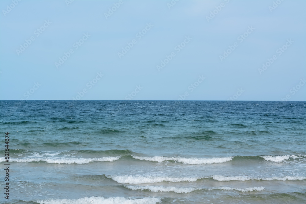 Picturesque view of sea with waves and blue sky Picturesque view of sea with waves and blue sky