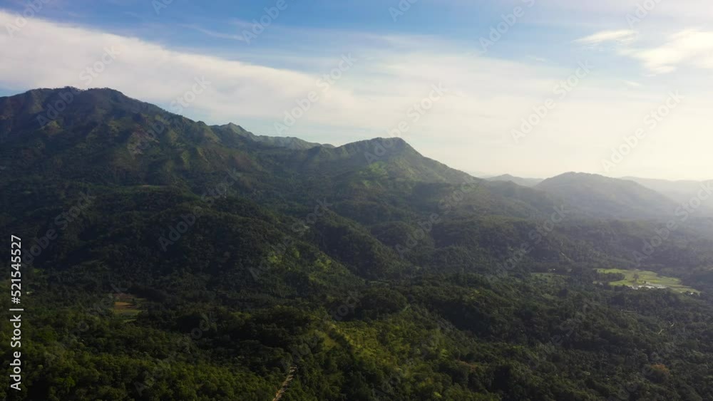 The slopes of the mountains covered with rainforest in the morning mist. Sri Lanka. The slopes of the mountains covered with rainforest in the morning mist. Sri Lanka.