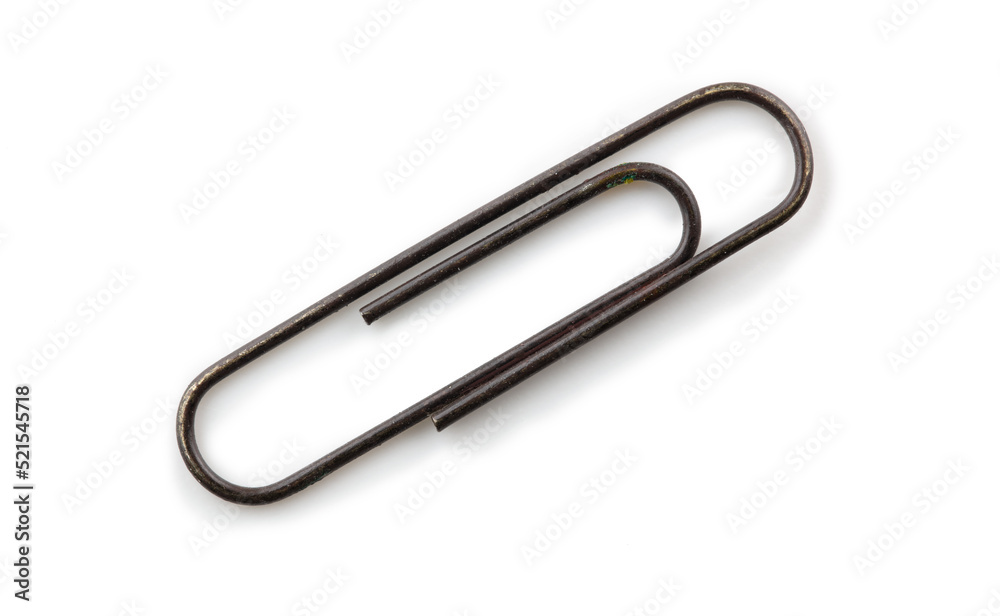 Old rusted paper clip, isolated on white, with natural shadows. Old rusted paper clip, isolated on white, with natural shadows.