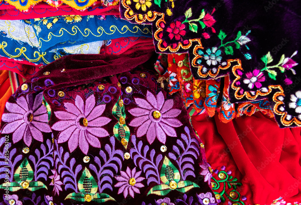 Close up of the skirt with traditional design for Cuenca city and Azuay province of Ecuador. It embroidered with silk thread and adorned with sequins and beads.