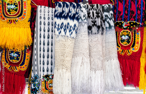Scarves or makans from Ecuador at the market made using a technique called ikat and knitting. Traditional craft and design for Gualaceo canton, Azuay province. photo