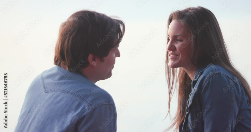 Couple look at each other romantically during sunset. Couple look at each other romantically during sunset.