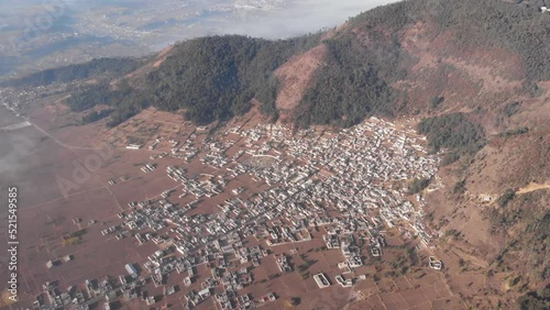 Vista aérea de pueblo guatemalteco conocido como San Andrés Xecul para ilustrar cómo se ven los pueblos indígenas desde arriba photo