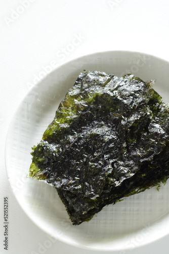 Korean food, sesame oil seaweed sheet on white dish © jreika