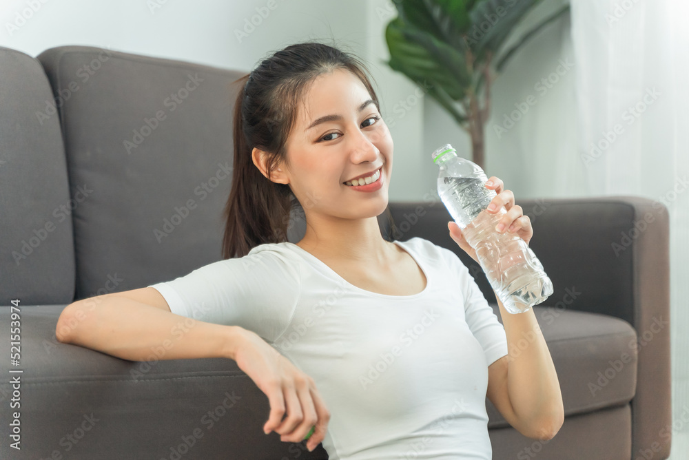 woman drinking water after exercise to fill dehydration woman drinking water after exercise to fill dehydration