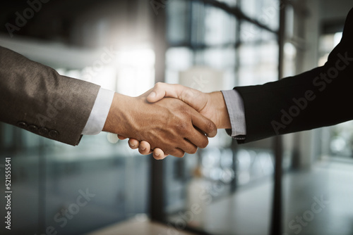 Handshake, collaboration and businessmen celebrating and congratulating on success for a sealed deal. HR manager hiring employee after successful interview. Hands of partners shaking on agreement.