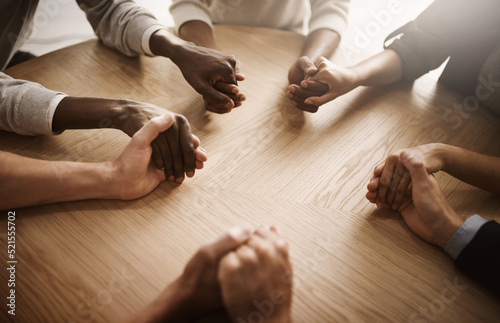 Care, support and teamwork by group of people holding hands in a circle. Community, trust and strength in togetherness, team with a vision or idea. Partnership between ambitious colleagues huddling