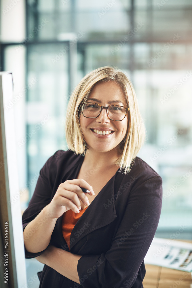 Fototapeta premium Happy, professional and corporate business woman writing creative ideas, taking notes and brainstorming alone in an office at work. Portrait of a smiling employee planning and designing a strategy