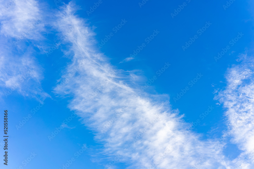 Transparent white clouds on the background of the blue sky Transparent white clouds on the background of the blue sky