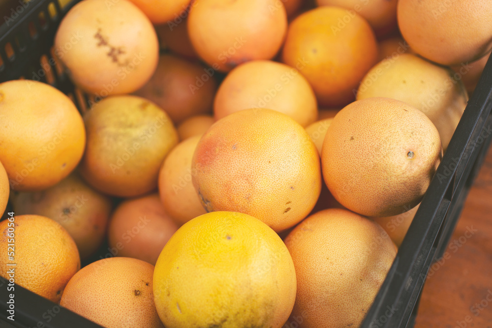 A view of a crate full of grapefruit. A view of a crate full of grapefruit.