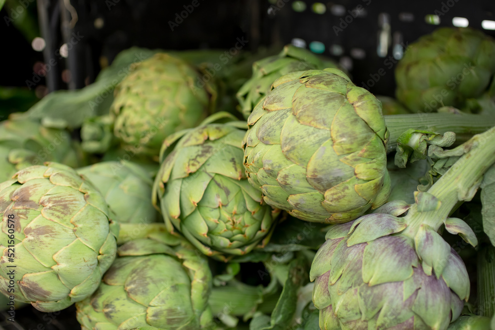 A view of several artichoke heads, on display at a local farmers market. A view of several artichoke heads, on display at a local farmers market.
