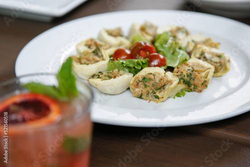 A view of a plate of stuffed artichoke hearts.