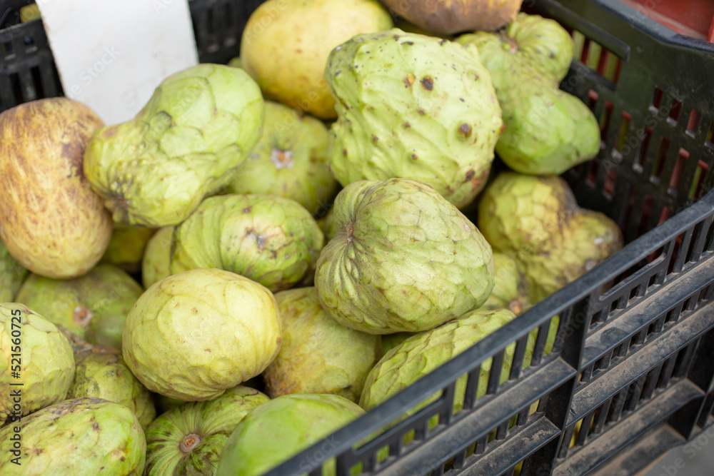 A view of a crate of cherimoya fruit, on display at a local farmers market. A view of a crate of cherimoya fruit, on display at a local farmers market.