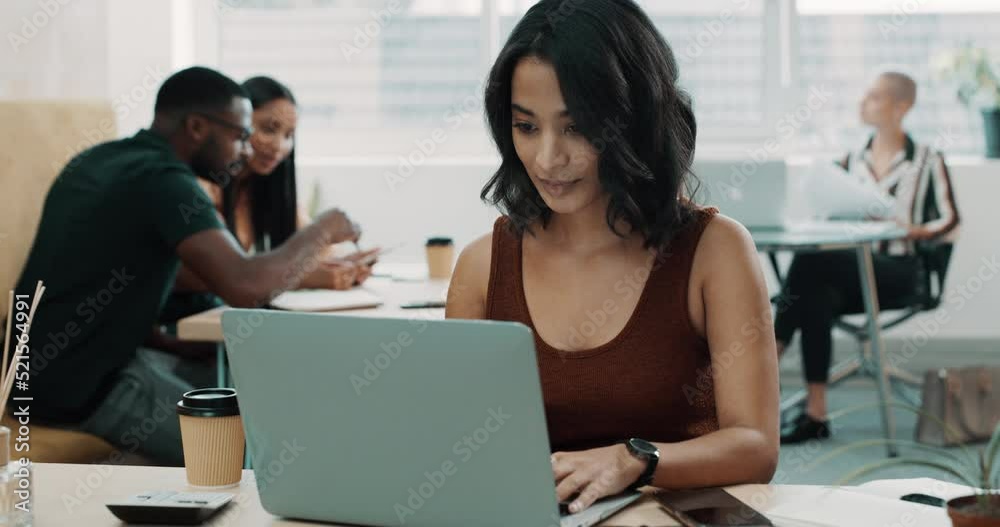 Creative entrepreneur texting on phone, typing on laptop and browsing social media. Serious, confident and ambitious business woman thinking and planning idea while colleagues work in the background Creative entrepreneur texting on phone, typing on laptop and browsing social media. Serious, confident and ambitious business woman thinking and planning idea while colleagues work in the background