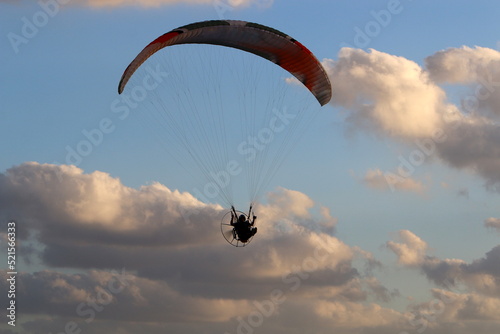 Paragliding in the sky over the Mediterranean Sea.