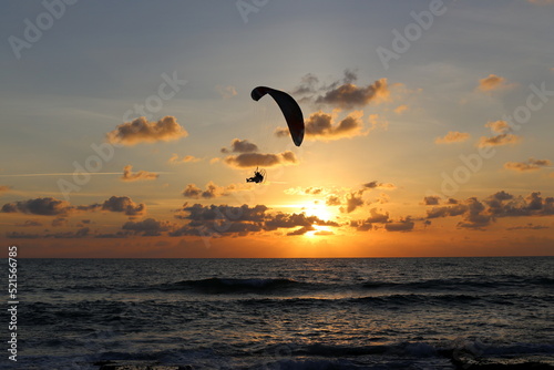 Paragliding in the sky over the Mediterranean Sea.