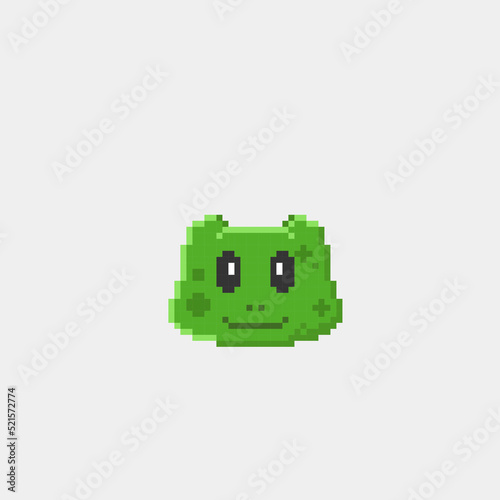 green frog head in pixel art style