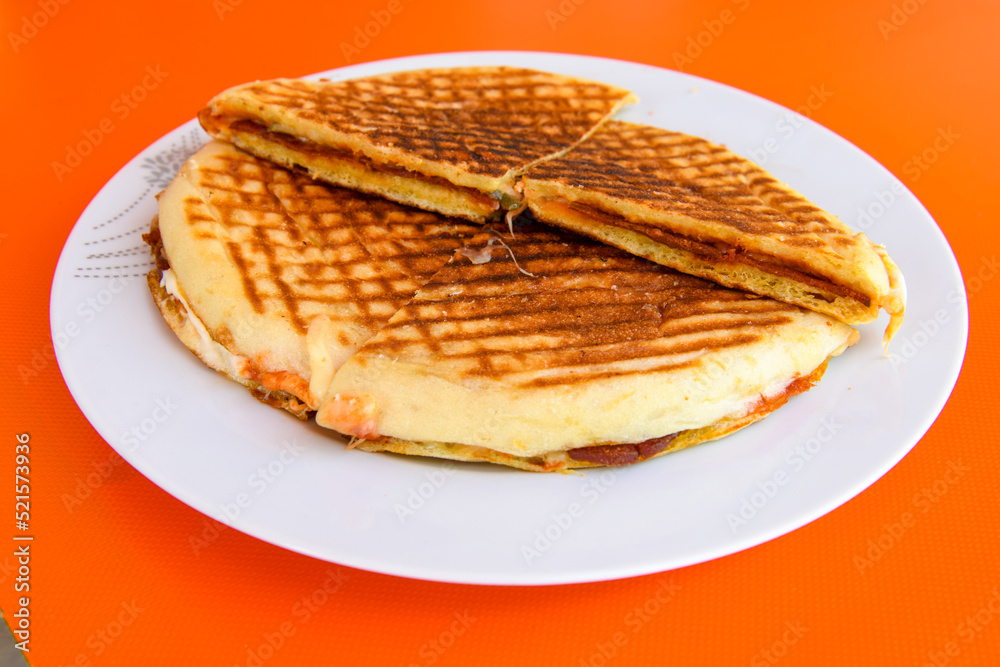 Turkish toast, mixed toast with cheddar cheese, sausage and ham, with fried potatoes (Turkish name; Bazlama Karisik tost) Turkish toast, mixed toast with cheddar cheese, sausage and ham, with fried potatoes (Turkish name; Bazlama Karisik tost)