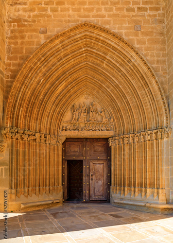 Ornate facade of Iglesia de Santa Maria fortress church in Ujue, Spain