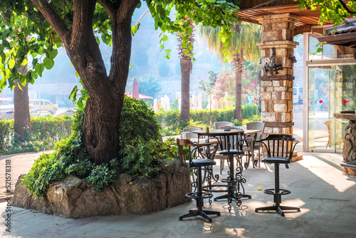 Cafe tables under a tree, Marmaris, Turkey